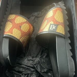 MCM Black and Gold Patterned Slides